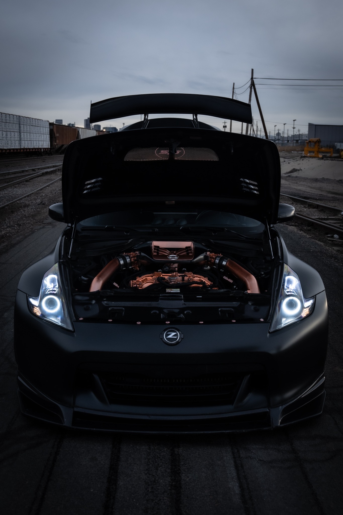 ThatBlack370 with its carbon hood open and copper-finished engine bay